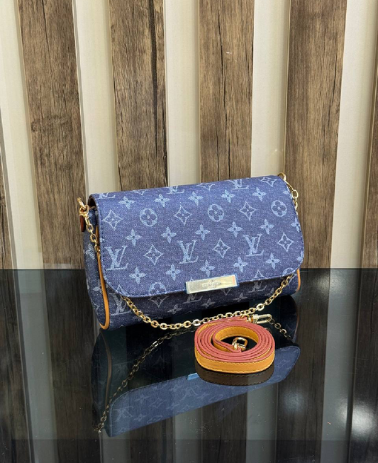 Louis Vuitton clutch jeans